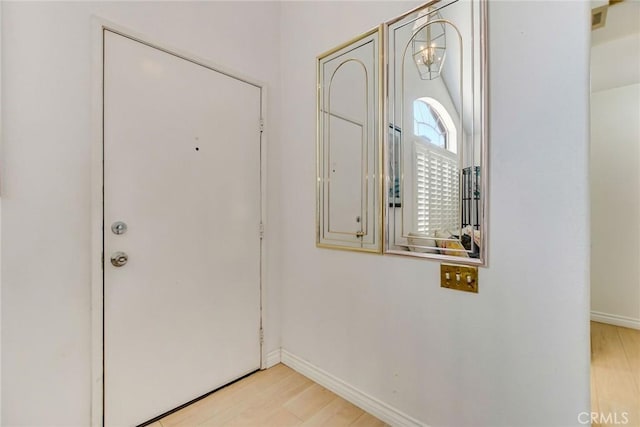5575 Osborne Ct, San Bernardino, CA 92407 - entryway featuring light wood-style flooring and baseboards