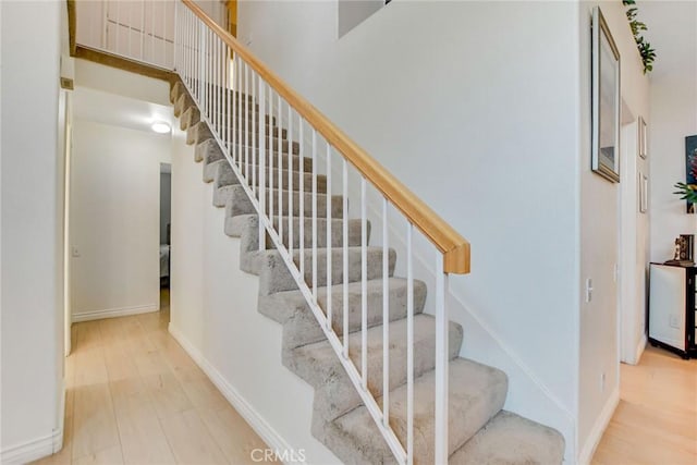 5575 Osborne Ct, San Bernardino, CA 92407 - stairway featuring wood finished floors