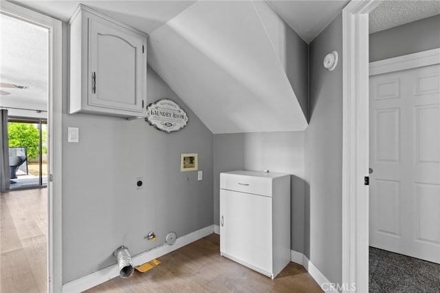 7209 Copper Creek Way, Bakersfield, CA 93308 - laundry room with hookup for a washing machine, gas dryer hookup, hookup for an electric dryer, wood finished floors, and cabinet space