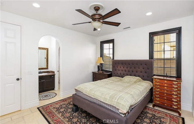 41 Balcony, Irvine, CA 92603 - bedroom featuring arched walkways, recessed lighting, connected bathroom, and a ceiling fan