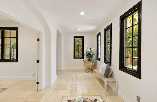 41 Balcony, Irvine, CA 92603 - corridor featuring recessed lighting, stone tile floors, and arched walkways