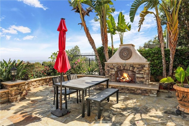 41 Balcony, Irvine, CA 92603 - view of patio with an outdoor stone fireplace and outdoor dining area