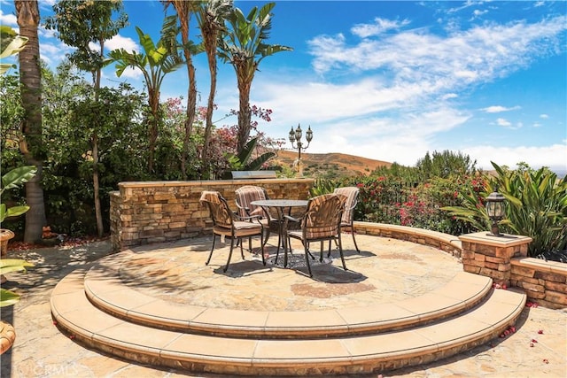 41 Balcony, Irvine, CA 92603 - view of patio with a mountain view and outdoor dining area