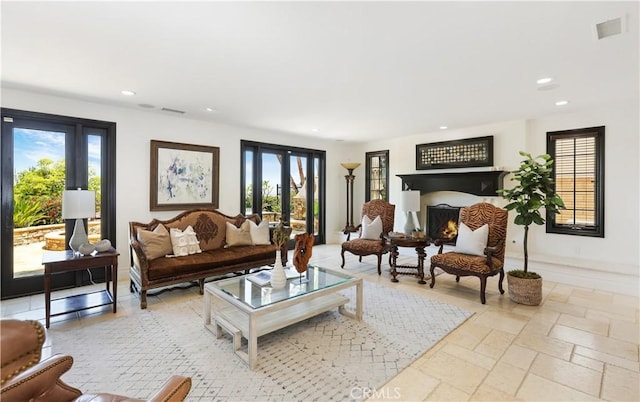 41 Balcony, Irvine, CA 92603 - living room featuring healthy amount of natural light, recessed lighting, and stone tile floors