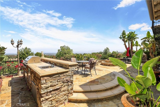 41 Balcony, Irvine, CA 92603 - view of patio featuring area for grilling and a fire pit