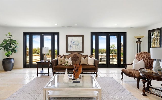 41 Balcony, Irvine, CA 92603 - living area with french doors, healthy amount of natural light, recessed lighting, and light tile patterned flooring