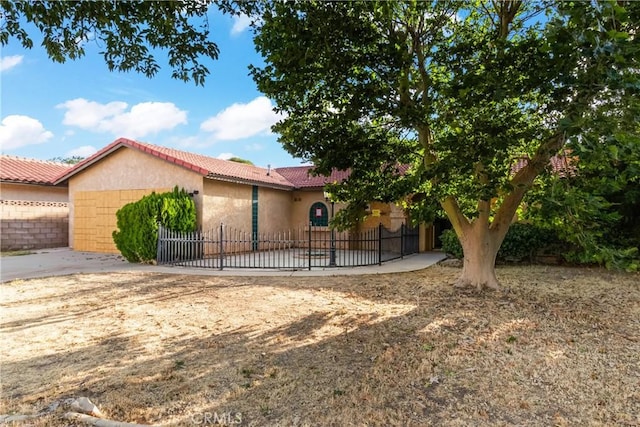 42865 Normandy Ln, Lancaster, CA 93536 - view of front of property featuring stucco siding and a tiled roof