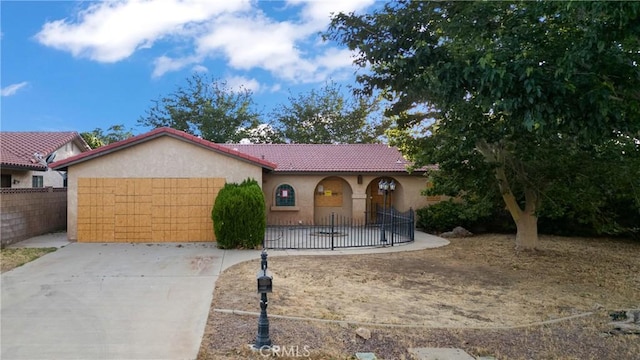 42865 Normandy Ln, Lancaster, CA 93536 - mediterranean / spanish-style home featuring a tile roof, stucco siding, and concrete driveway