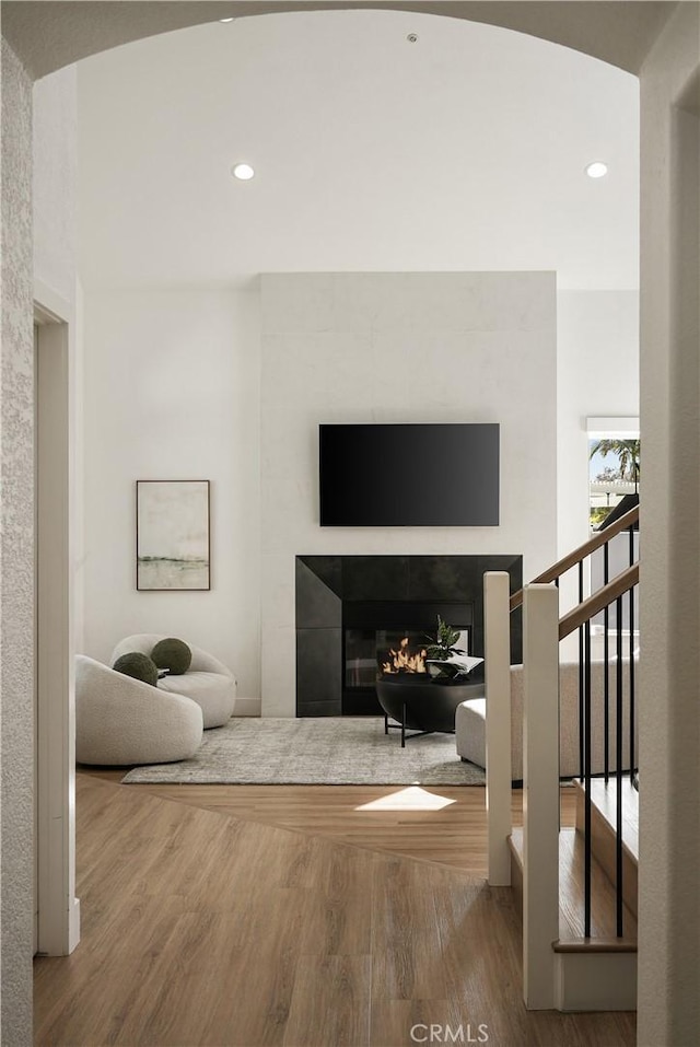 3010 Vina Vial, San Clemente, CA 92673 - living area featuring wood finished floors, recessed lighting, and a glass covered fireplace