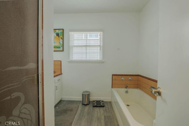 511 Delaware Rd, Burbank, CA 91504 - full bathroom featuring wood finished floors, a garden tub, and vanity