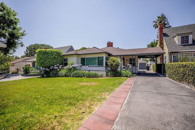 511 Delaware Rd, Burbank, CA 91504 - view of front of property featuring a front lawn, an attached carport, asphalt driveway, and a chimney