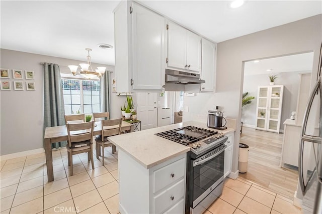 14020 Orizaba Ave Unit 6A, Paramount, CA 90723 - kitchen with stainless steel range with gas stovetop, under cabinet range hood, a chandelier, white cabinetry, and recessed lighting