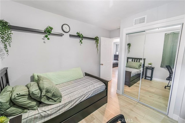 14020 Orizaba Ave Unit 6A, Paramount, CA 90723 - bedroom with light wood-style flooring and a closet
