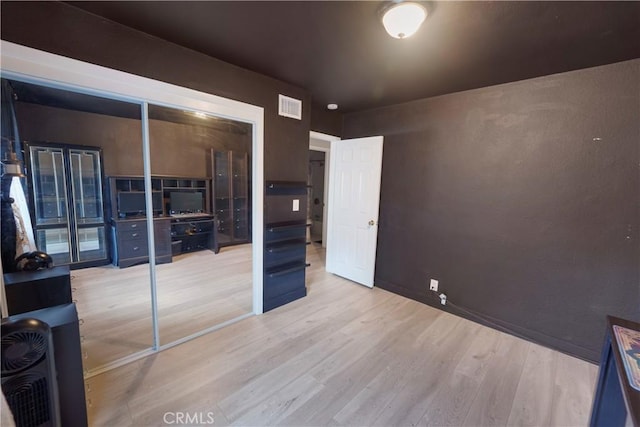14020 Orizaba Ave Unit 6A, Paramount, CA 90723 - unfurnished bedroom featuring wood finished floors
