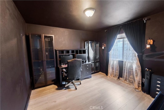 14020 Orizaba Ave Unit 6A, Paramount, CA 90723 - home office featuring wood finished floors and a textured wall