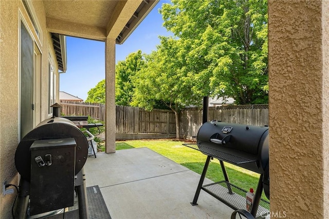 1968 Bancroft Dr, Chico, CA 95928 - fenced backyard with a patio and a grill