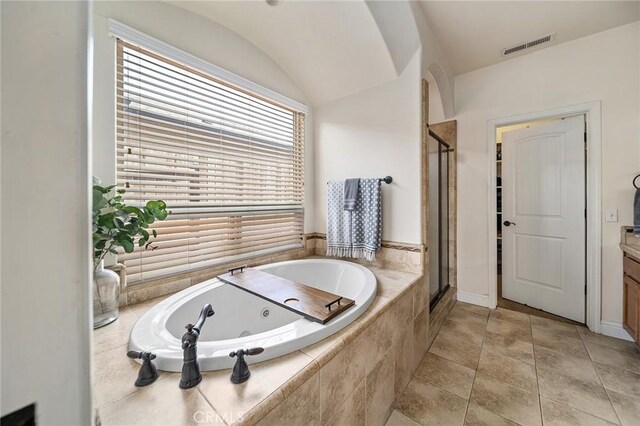 1968 Bancroft Dr, Chico, CA 95928 - bathroom featuring a tub with jets, a stall shower, and vanity