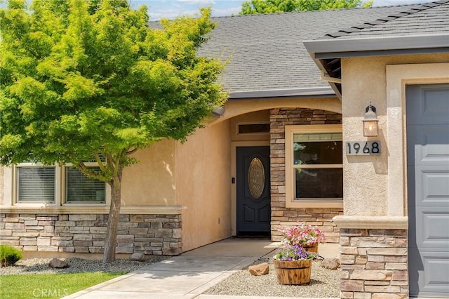 1968 Bancroft Dr, Chico, CA 95928 - entrance to property featuring stone siding, stucco siding, and a shingled roof