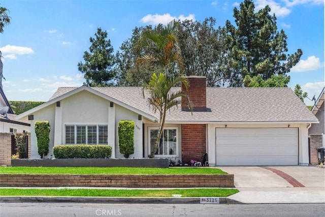 3125 Yukon Ave, Costa Mesa, CA 92626 - view of front of house featuring an attached garage, driveway, stucco siding, and roof with shingles