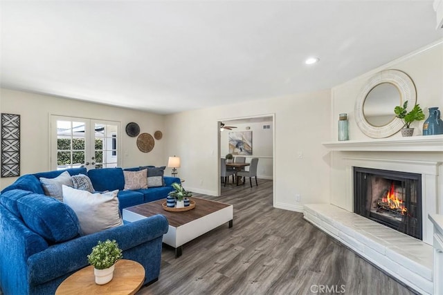 3125 Yukon Ave, Costa Mesa, CA 92626 - living room with french doors, wood finished floors, a lit fireplace, and recessed lighting