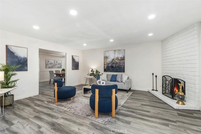 3125 Yukon Ave, Costa Mesa, CA 92626 - living area with wood finished floors, recessed lighting, and a fireplace