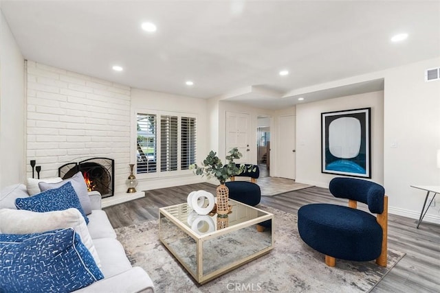 3125 Yukon Ave, Costa Mesa, CA 92626 - living area with wood finished floors, a fireplace, and recessed lighting