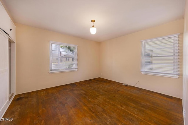 237 N Katherine Dr, Ventura, CA 93003 - unfurnished bedroom with dark wood-type flooring and a closet