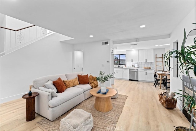 1262 E Ln Palma Ave Unit A, Anaheim, CA 92805 - living area with light wood-style floors and recessed lighting