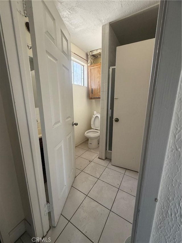 119 W Francis St, Corona, CA 92882 - bathroom featuring a textured ceiling and tile patterned flooring