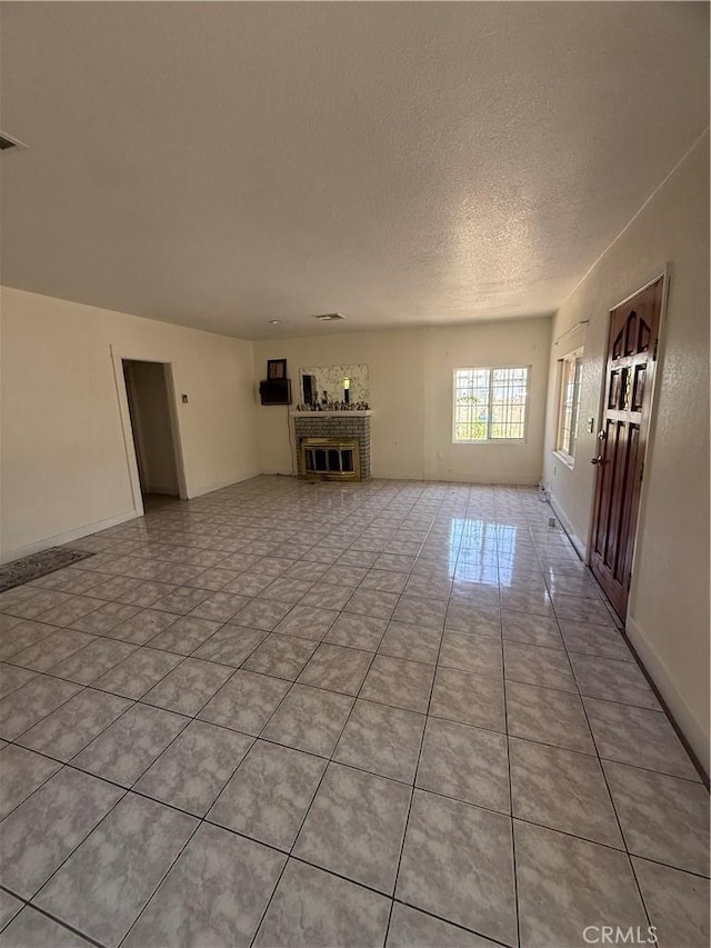 119 W Francis St, Corona, CA 92882 - unfurnished living room with a textured ceiling and light tile patterned floors