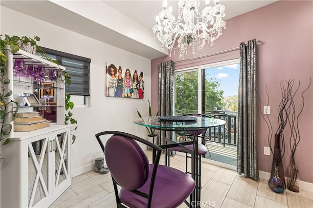 4842 Buchanan St, Los Angeles, CA 90042 - dining area featuring a chandelier and baseboards