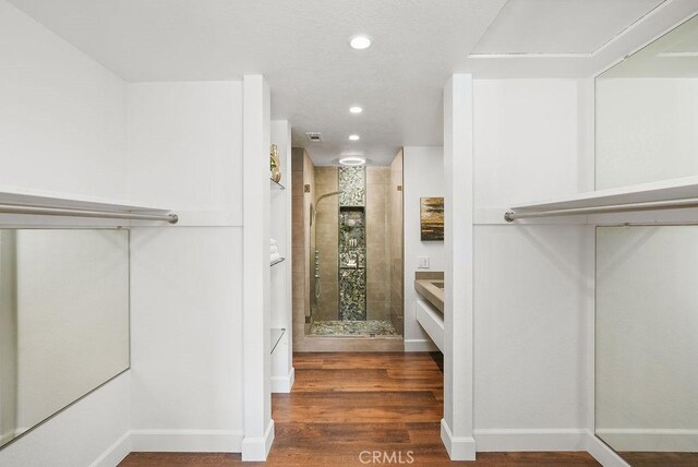 24511 Sutton Ln, Laguna Niguel, CA 92677 - walk in closet featuring wood finished floors