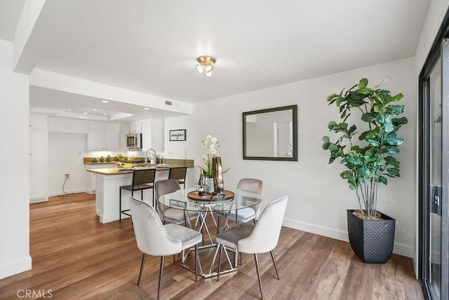 24511 Sutton Ln, Laguna Niguel, CA 92677 - dining room featuring wood finished floors and recessed lighting