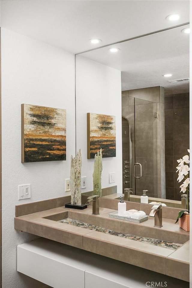 24511 Sutton Ln, Laguna Niguel, CA 92677 - bathroom with vanity, recessed lighting, and a stall shower