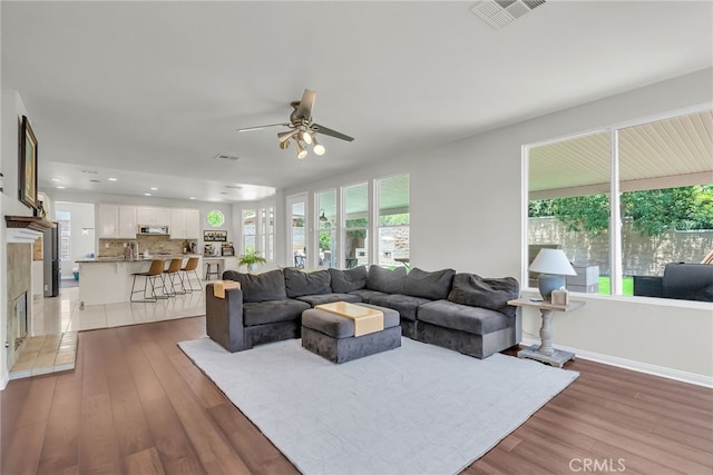 1775 Honors Ln, Corona, CA 92883 - living room featuring light wood-style flooring, ceiling fan, and recessed lighting
