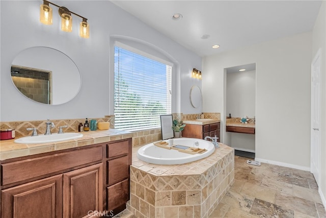 1775 Honors Ln, Corona, CA 92883 - bathroom with a garden tub, two vanities, stone tile flooring, and recessed lighting