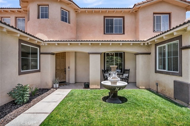 1775 Honors Ln, Corona, CA 92883 - mediterranean / spanish home with stucco siding, a front yard, a tile roof, and a patio area