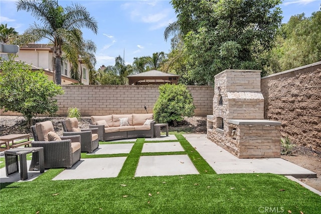 1775 Honors Ln, Corona, CA 92883 - view of yard with an outdoor living space with a fireplace and a patio