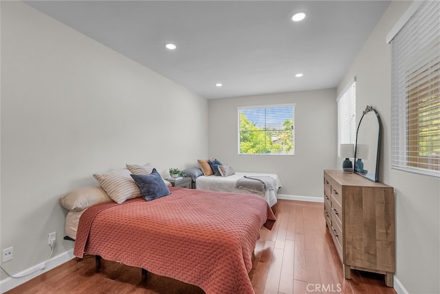 1775 Honors Ln, Corona, CA 92883 - bedroom featuring multiple windows, light wood-style flooring, and recessed lighting