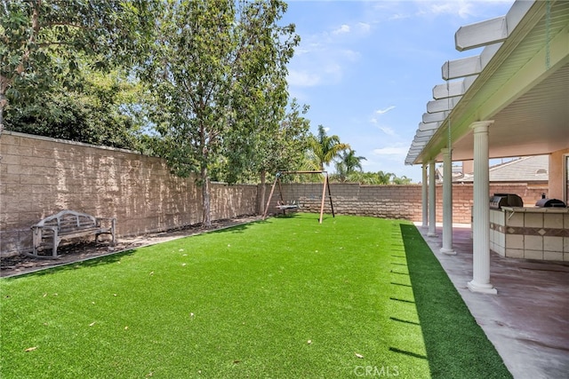 1775 Honors Ln, Corona, CA 92883 - fenced backyard featuring an outdoor kitchen and a patio area