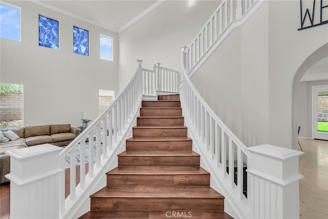 1775 Honors Ln, Corona, CA 92883 - stairway with a high ceiling, arched walkways, and crown molding