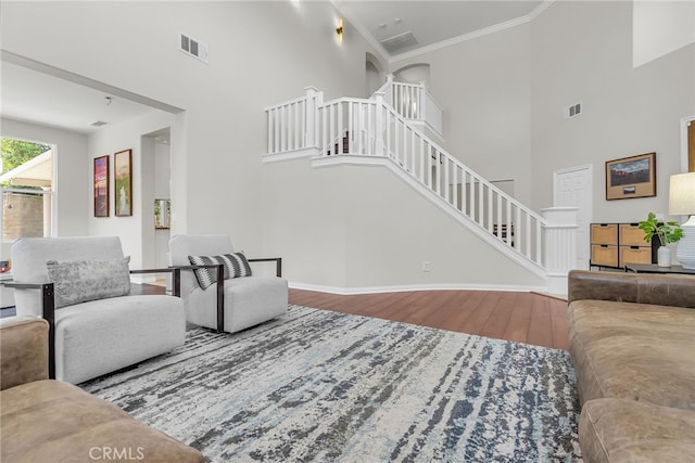 1775 Honors Ln, Corona, CA 92883 - living area with stairway, wood finished floors, a high ceiling, and crown molding