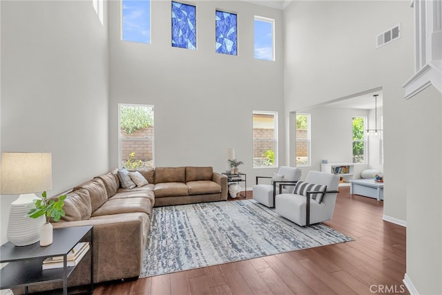 1775 Honors Ln, Corona, CA 92883 - living area featuring a high ceiling, hardwood / wood-style flooring, and crown molding