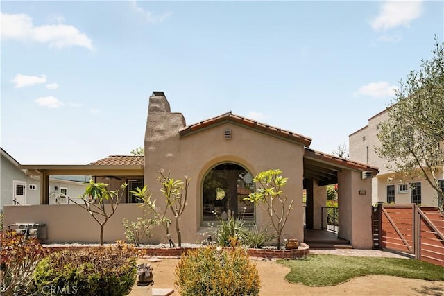 3848 Boyce Ave, Los Angeles, CA 90039 - view of front facade with stucco siding, a gate, and a tiled roof