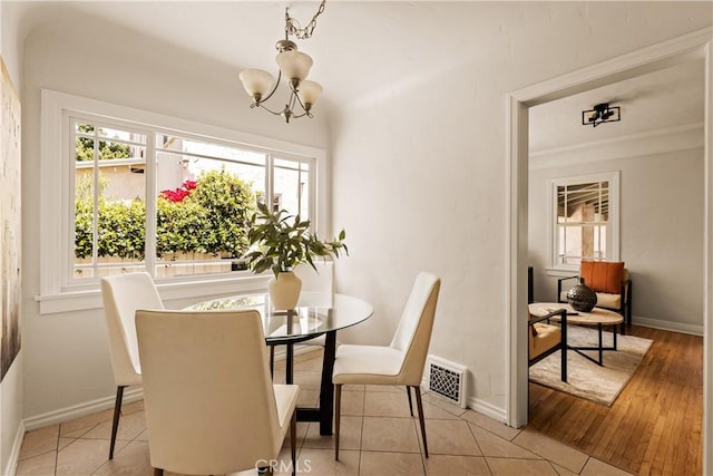 3848 Boyce Ave, Los Angeles, CA 90039 - dining area featuring a chandelier and baseboards