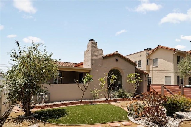 3848 Boyce Ave, Los Angeles, CA 90039 - mediterranean / spanish house with a chimney, a tiled roof, and stucco siding