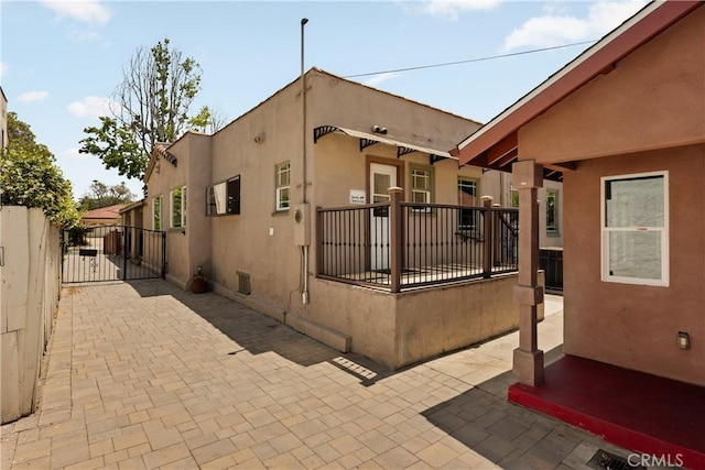 3848 Boyce Ave, Los Angeles, CA 90039 - view of front of property with stucco siding, a gate, and a patio