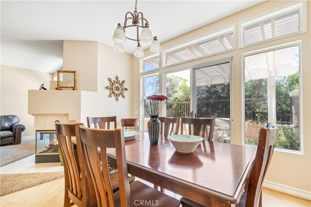 100 Stoney, Laguna Niguel, CA 92677 - dining area featuring a chandelier, plenty of natural light, and light tile patterned floors