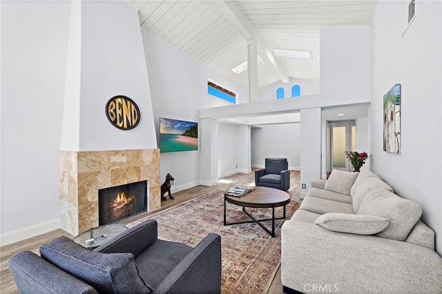 24191 Vis D Oro, Dana Point, CA 92629 - living area with wood finished floors, beamed ceiling, a tiled fireplace, and high vaulted ceiling
