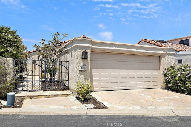 24191 Vis D Oro, Dana Point, CA 92629 - view of front of property with stucco siding, a garage, a tile roof, and concrete driveway